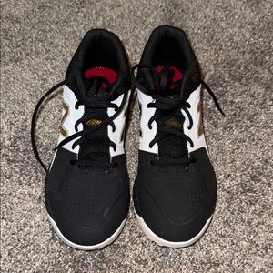 New Balance woman’s turf shoes